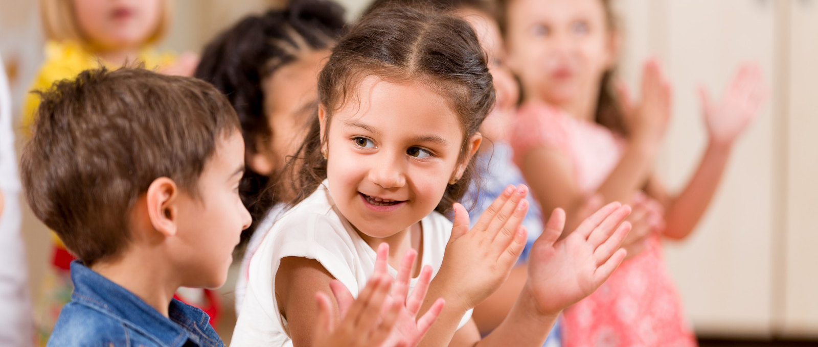 Child playing with other children in school using soft skills