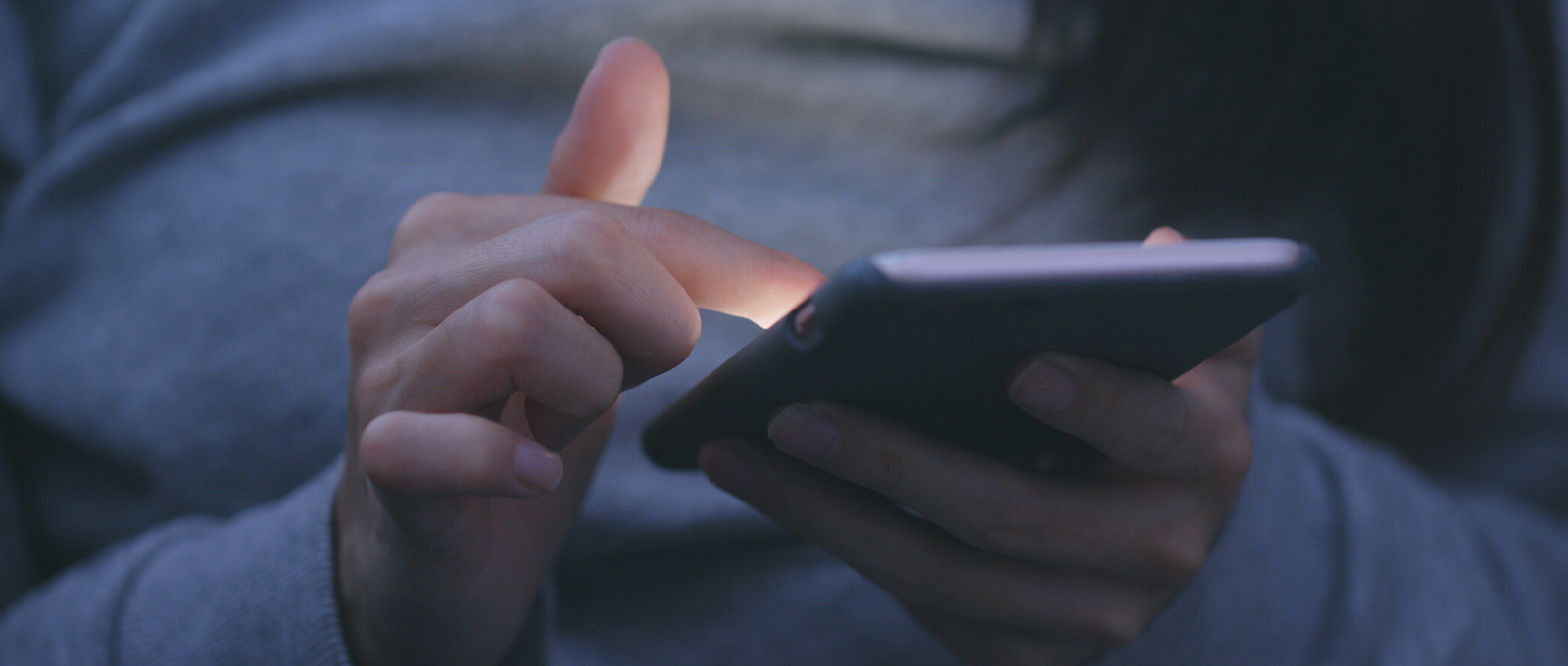 Teenager checking their cell phone