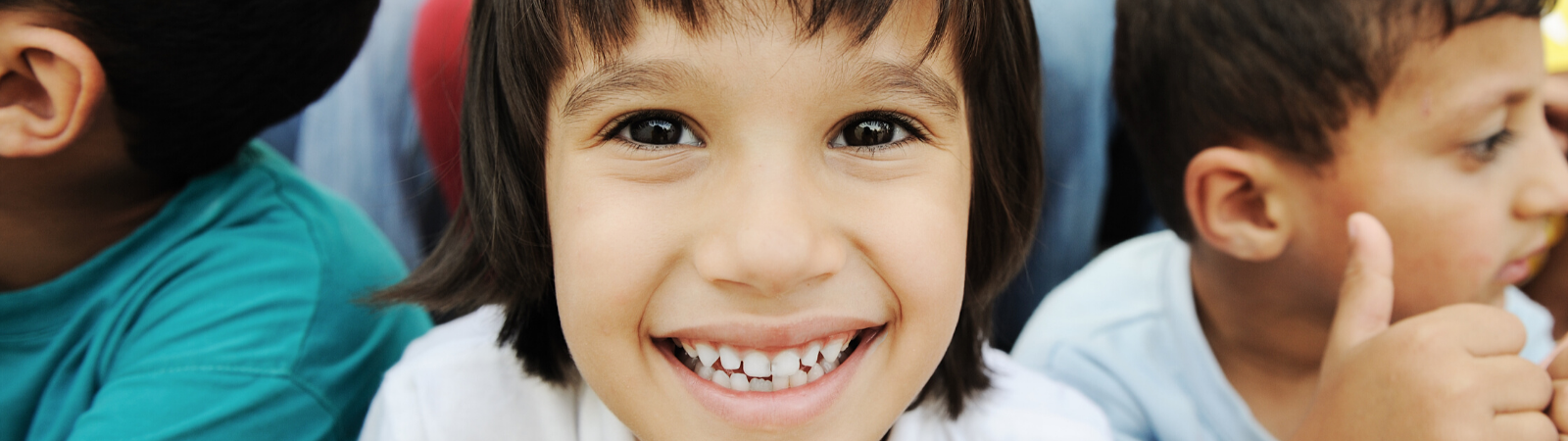 Child smiling straight into camera. 