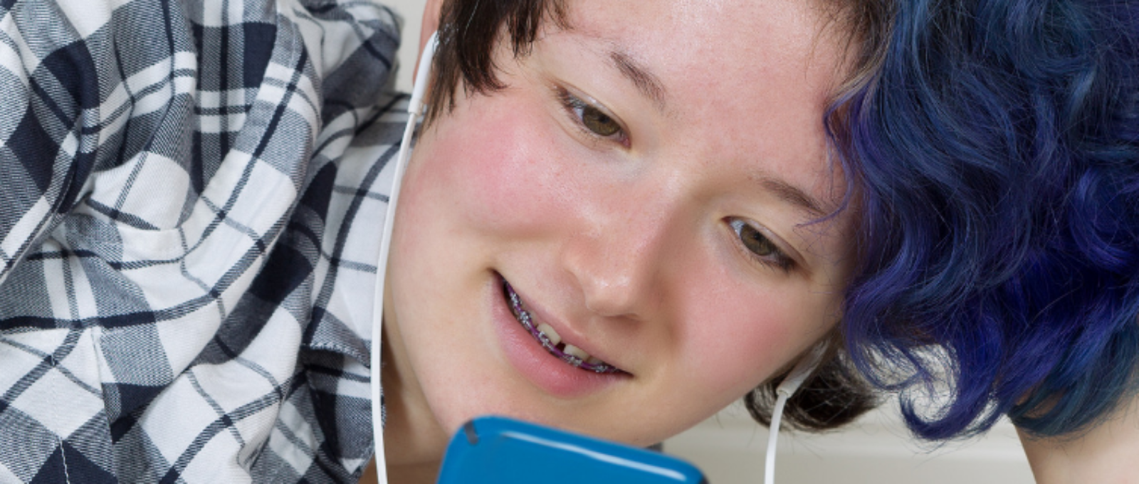 Teenager looking at phone