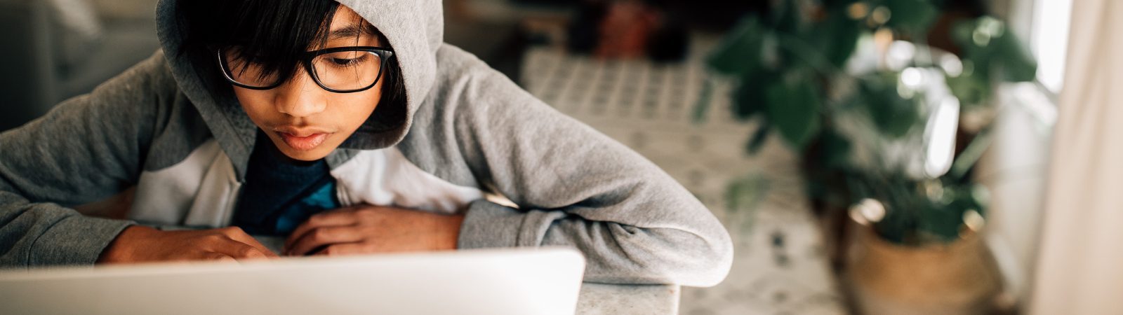 Child trying to focus their attention during distance learning