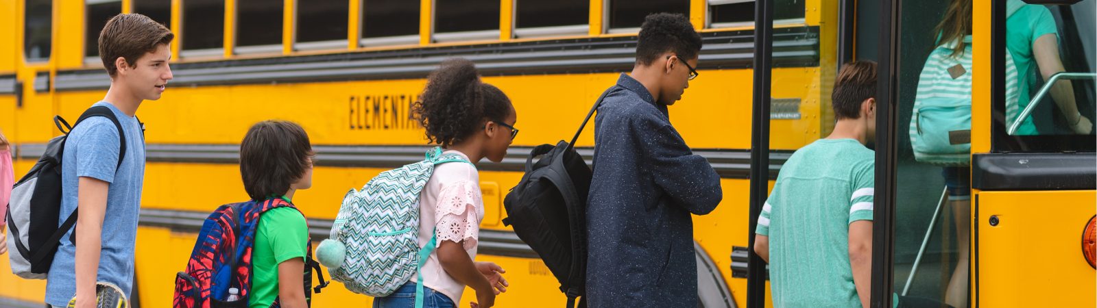 Kids getting on school bus