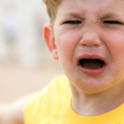 Child crying who needs an emotion coach to help handle his feelings