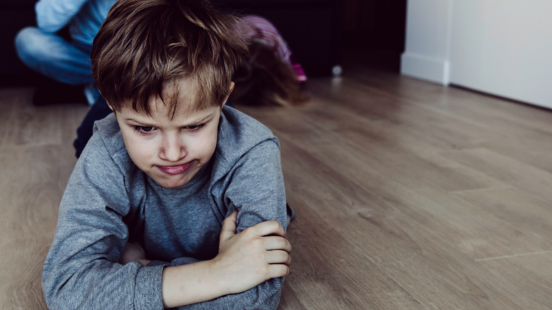 Child tantrumming stressed on floor