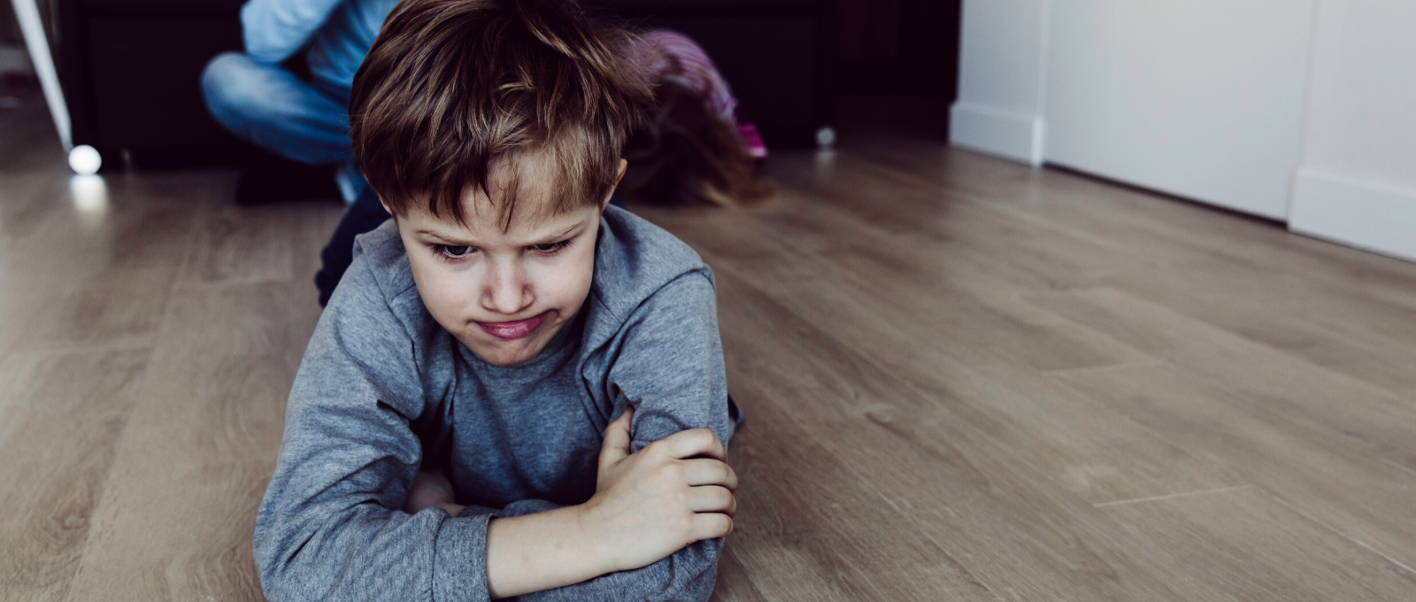 Child tantrumming stressed on floor