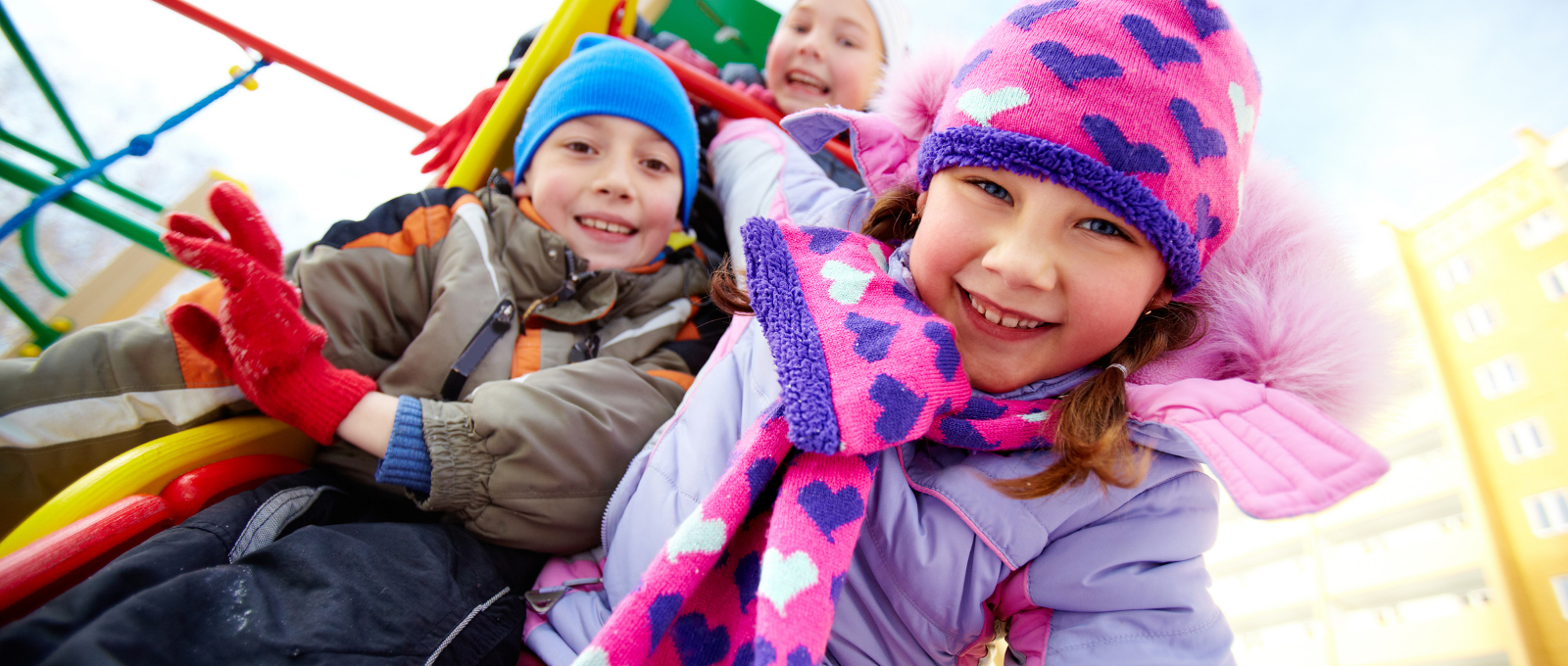 kids playing outside in the snow