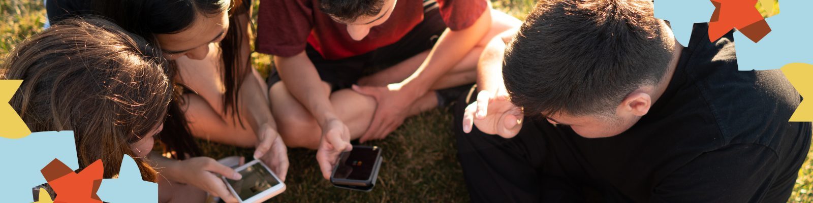 Teens sitting in a circle using generative AI on their cell phones.