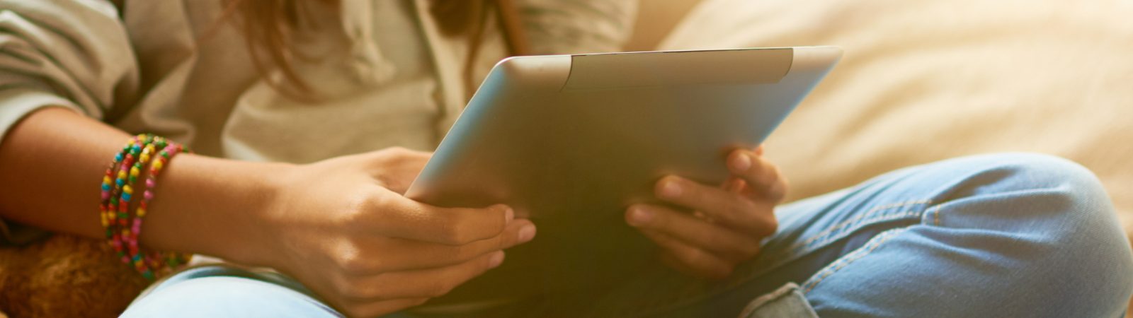 Tween using tablet during pandemic screen time