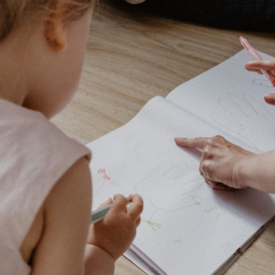 Parenting raising writer by playing and drawing with them on floor