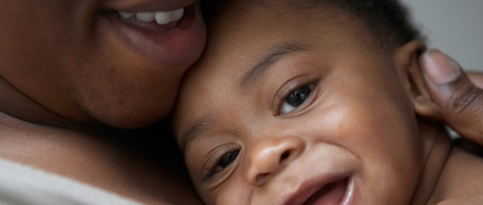 Baby experiencing secure attachment with caregiver